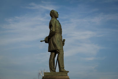 Low angle view of statue against sky