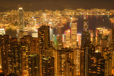 High angle view of illuminated city buildings at night