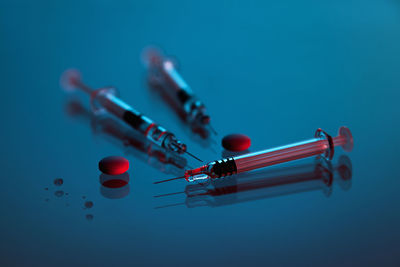 Syringes and tablets on white background, covid-19 corona virus vaccine and medicine