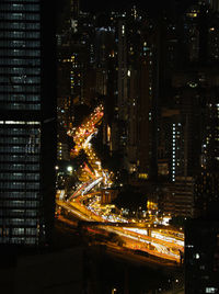High angle view of illuminated buildings in city at night