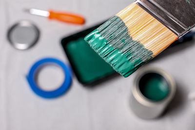 Close-up of green paint on brush