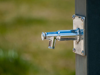 Close-up of faucet on pole