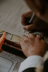 Cropped image of man working on table