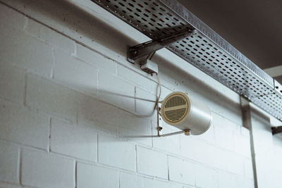 Low angle view of speaker mounted on wall