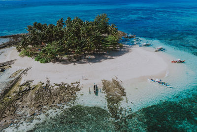 Drone view of man at beach on sunny day