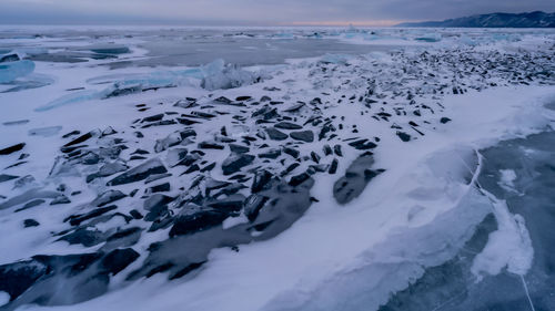 Scenic view of frozen landscape against sky. baykal.