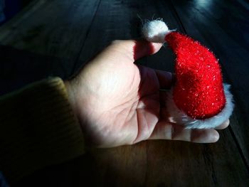 High angle view of woman hand holding umbrella