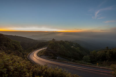 Scenic view of mountains against sky during sunset