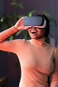 Afro woman wear virtual reality glasses look on digital simulation in cyberspace enjoy vr technology