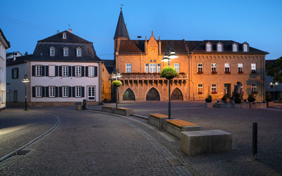 Buildings in city against clear sky