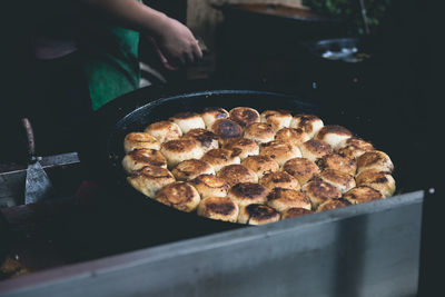 Close-up of person preparing food in store