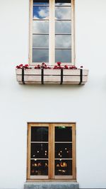 Low angle view of glass window of house