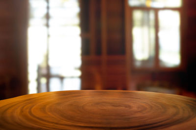 Close-up of wooden table at home
