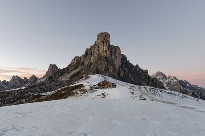 Scenic view of snowcapped mountains against clear sky