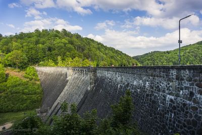 Scenic view of dam against sky