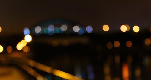 Defocused image of illuminated lights at night