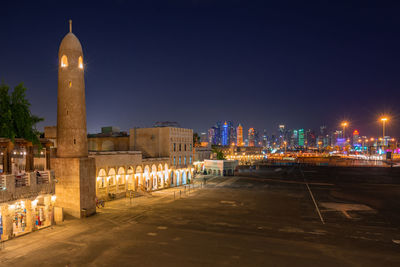 Illuminated buildings in city at night