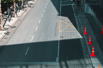 High angle view of arrow symbol on road in city