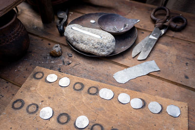 High angle view of coins on table