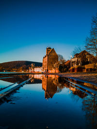 Scenic view of river weser against clear blue sky