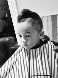 Portrait of cute boy looking at home