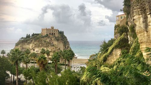 Panoramic view of sea and buildings against sky