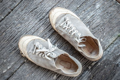 High angle view of shoes on wooden table