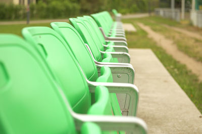 Empty green seats in row outdoor 