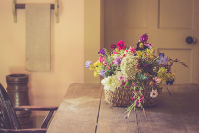 Flower vase on table at home