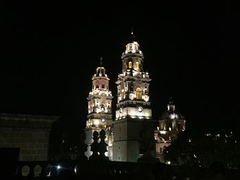 Low angle view of illuminated building at night