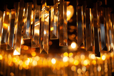 Close-up of illuminated lamp hanging at night