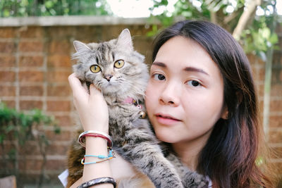 Portrait of woman with cat 