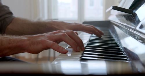 A photo of hands which are playing piano