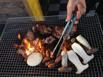 Cropped hand of person preparing food