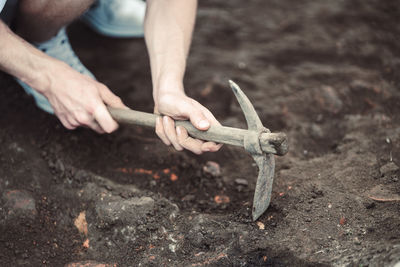 Low section of man working on road
