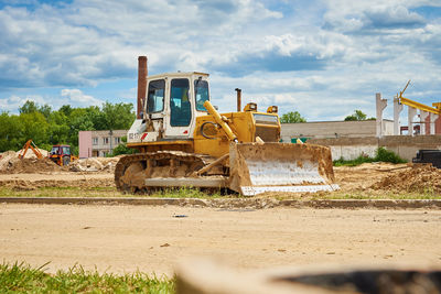 Yellow bulldozer at construction site