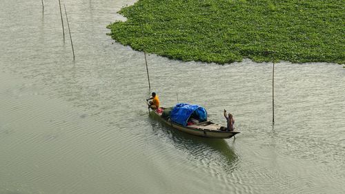 High angle view of people on boat in sea