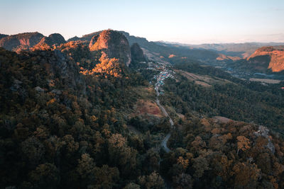 High angle view of trees and mountains against sky