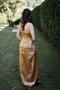 Rear view of woman standing in park