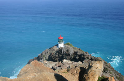 High angle view of lighthouse in sea