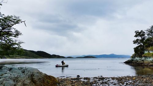 Scenic view of sea against cloudy sky