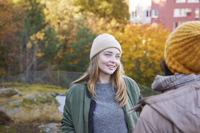 Women talking in autumn scenery