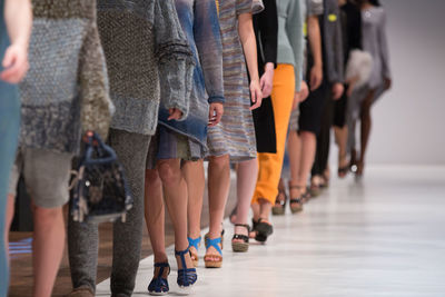 Full length of woman standing on tiled floor