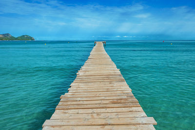 Pier over sea against sky