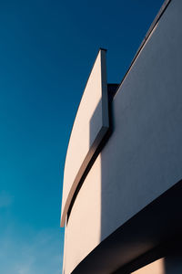 Low angle view of building against clear blue sky