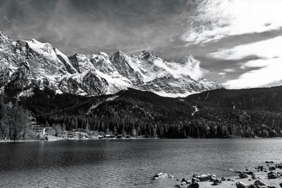 Scenic view of lake and mountains against sky