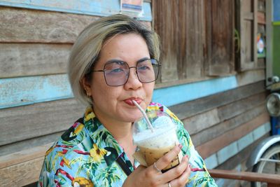 Young woman drinking juice