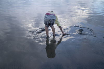 Rear view of woman in sea