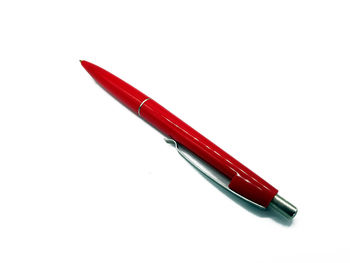 High angle view of red pencils on white background