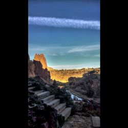 Scenic view of mountains against cloudy sky